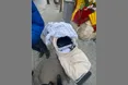У дитячому візочку — ноутбук з принтером